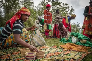 Batwa community selling crafts to tourists which helps for sustainable tourism